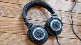 A pair of black Audio-Technica ATH-M50x headphone