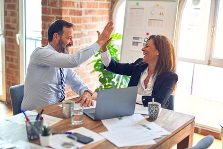 A man and woman happy in their workspace
Natural light improves your health in the home office