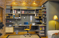 Picture of a well-organized home office with multiple storage solution and a portable chair
